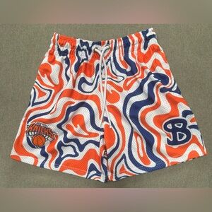 Bucketsquad men’s size medium Knicks Orange and Blue Patterned Shorts.